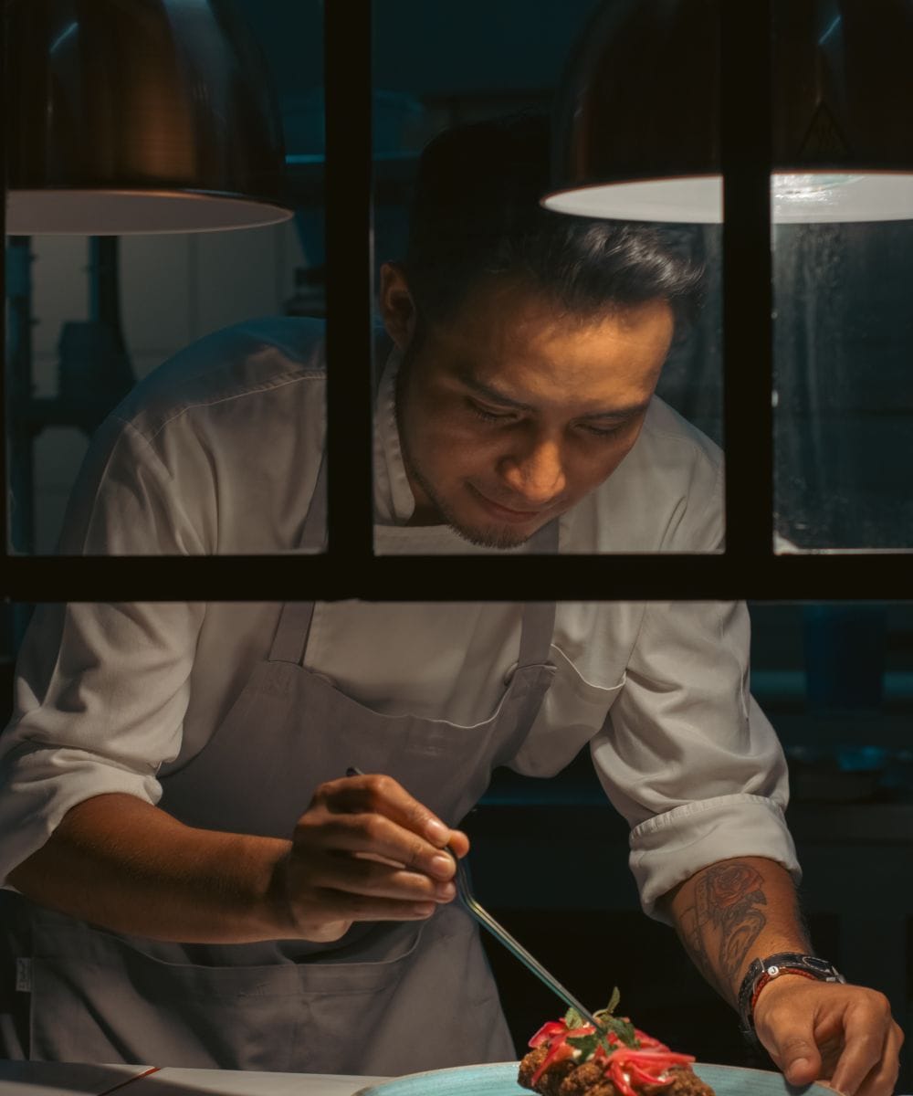 Executive chef plating a dish